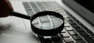 Magnifying glass on a computer keyboard